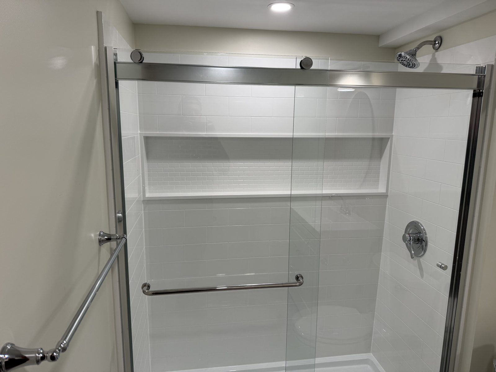 Custom bathroom with brass fixtures and tile